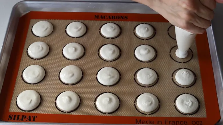 Preparing Salted Caramel Macarons for baking