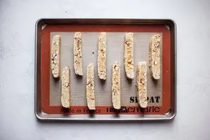cutting slices of Almond Biscotti