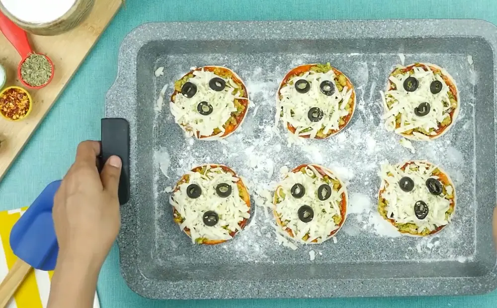 assembling Mini Pizza Bites for baking in oven